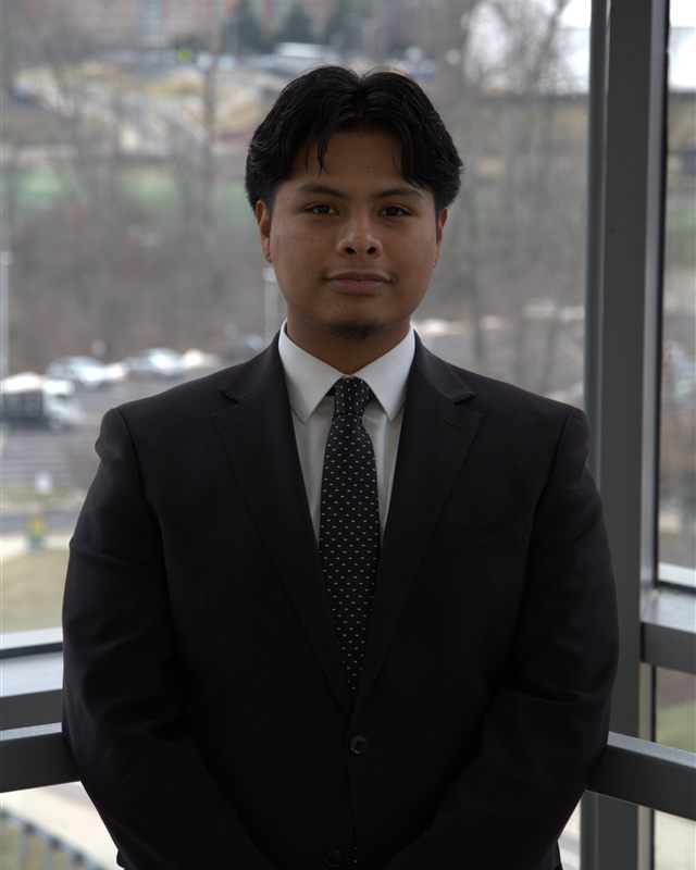 Antonio Sandoval-Duarte, founder of BrightCounts, in a dark suit and patterned tie